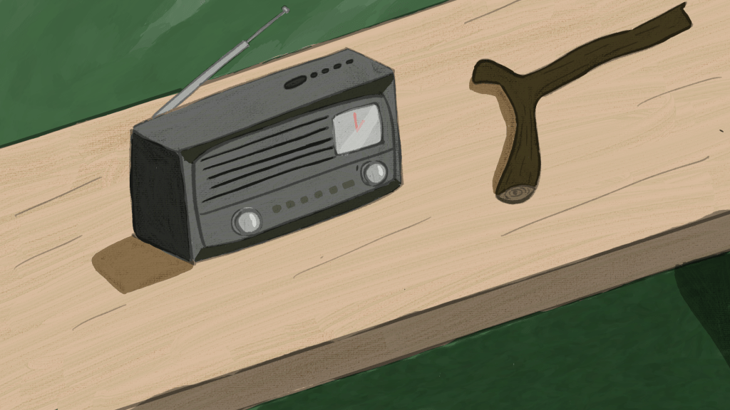 An old antenna radio and a gun-shaped stick on a bench.